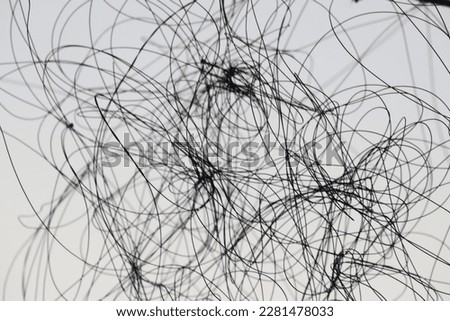 Tangled strings, dramatic view, the  concepts, in silhouettes, backgrounds. Royalty-Free Stock Photo #2281478033