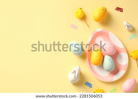 Happy Easter banner design. Easter eggs, bunny,  decorations on yellow table.