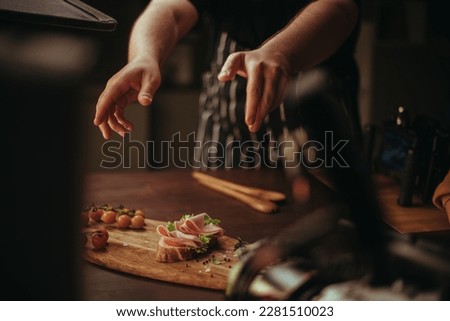 Professional shooting of food, food products in advertising and cinema. Close-up. The work of a food stylist on the set. Modern shooting technology.