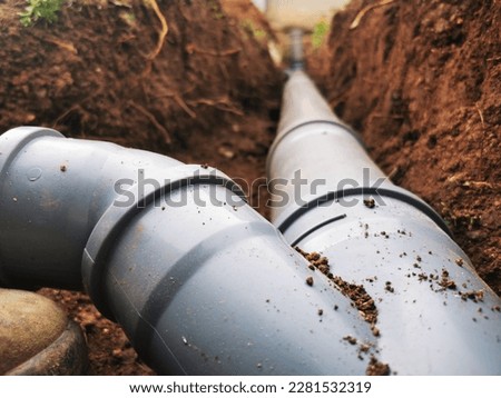 Plastic sawage pipes in the ground for rainwater drainage Royalty-Free Stock Photo #2281532319