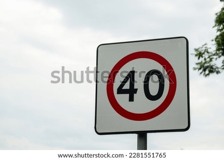 Speed limit sign with blue sky background. European Speed limit sign 40 km per hour. City zone attention road sign
