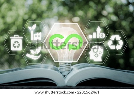 Circular economy concept, Light bulb on book with circular economy icon on virtual screen, renovating and recycling existing materials and products as much possible. Royalty-Free Stock Photo #2281562461