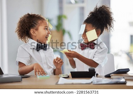 Happy, playful and girls pretending to be business people, having fun with sticky notes and office equipment. Smile, funny and children playing dress up, play pretend and a game of work together Royalty-Free Stock Photo #2281563731