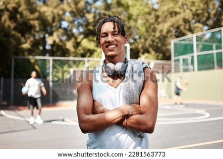 My heart is on that court. Portrait of a sporty young man standing on a basketball court.