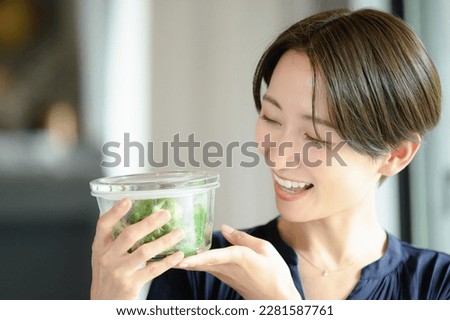 Low carbohydrate diet Woman with broccoli Royalty-Free Stock Photo #2281587761
