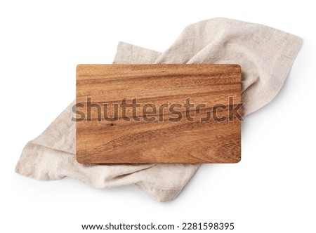 Wooden cutting board on linen napkin isolated on white background, top view Royalty-Free Stock Photo #2281598395