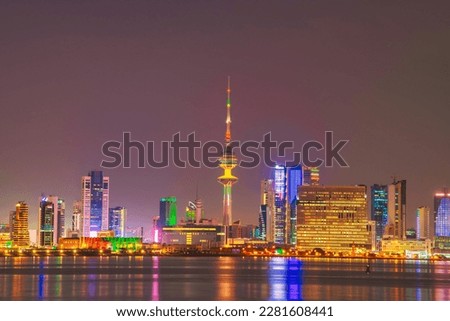 Kuwait Skyline view from beach during the national day celebration. Kuwait National day lights on the building and Kuwait flag lights during the night time. Kuwait City skyline view. Royalty-Free Stock Photo #2281608441