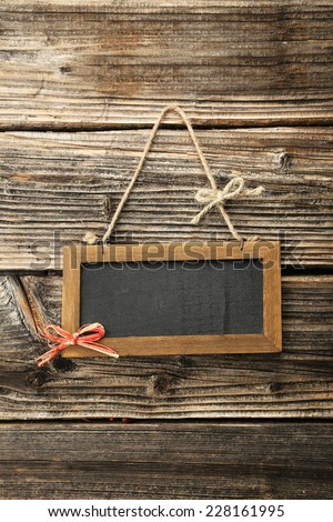 Brown wooden frame on brown wooden background
