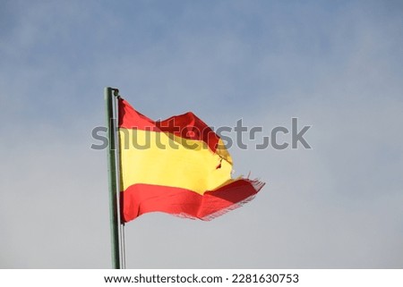 the Spanish flag in the wind in the province of Alicante, Costa Blanca, Spain