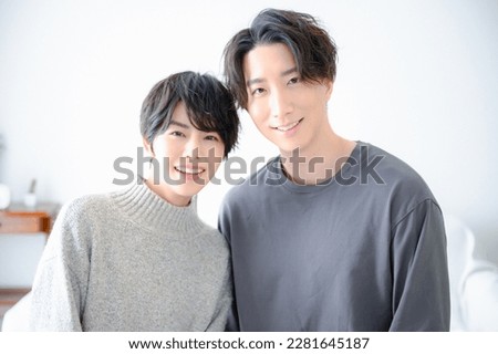 Asian couple looking at each other for the camera Royalty-Free Stock Photo #2281645187