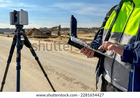 engineer surveyor at the construction site. High quality photo