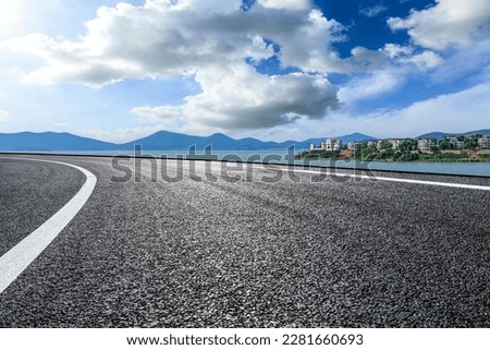 Asphalt road highway by the seaside Royalty-Free Stock Photo #2281660693