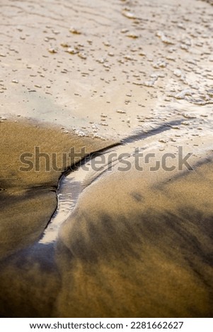 Creative beach sand with small stones