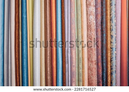 Picture of random shades of fabric canvases arranged in row. Cold and warm colors. Materials for creating new interesting and fashionable product. Royalty-Free Stock Photo #2281716527