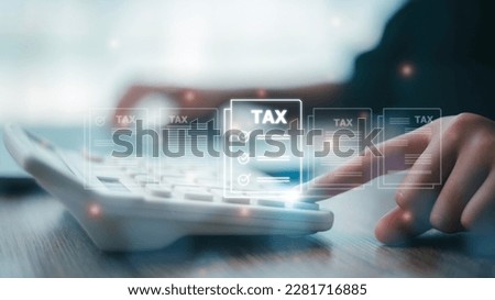 Corporate and individual tax payment concept, woman using computer filling out corporate and personal income tax return, VAT and property tax of business. Royalty-Free Stock Photo #2281716885