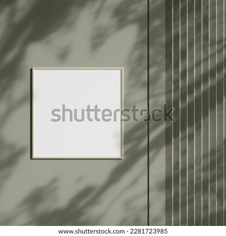 Photo frame mockup hanging on wall with shadow. Minimalist background. Blank picture frame mockup in living room.