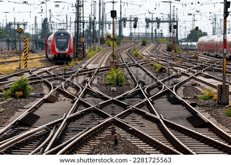 Railway tracks at Frankfurt main station Germany. Complex system of switches, crossings, overhead lines and signals for trains arriving and leaving. Royalty-Free Stock Photo #2281725563