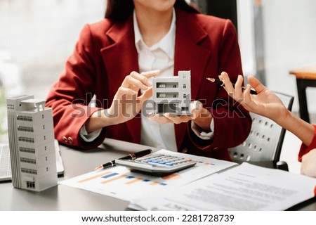  Signing a contract. Client and broker agent, lease agreement, successful deal and  Young business sitting at the desk in office 
 Royalty-Free Stock Photo #2281728739
