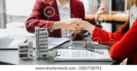  Signing a contract. Client and broker agent, lease agreement, successful deal and  Young business sitting at the desk in modern office  Royalty-Free Stock Photo #2281728751