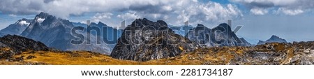 Wide panoramic view of the Rwenzori Mountains, Uganda. Weismanns peak summit in cloudy day. Royalty-Free Stock Photo #2281734187