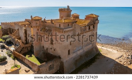 Aerial view of the Castle of Santa Severa, located in Santa Marinella in Lazio, in the Metropolitan City of Rome, Italy. It is a medieval castle built on the beach and overlooking the Tyrrhenian Sea.