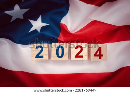 United States presidential election 2024. Wooden cubes with the letters 2024 on the American flag background. Politics and voting conceptual Royalty-Free Stock Photo #2281769449