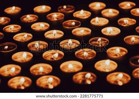 many burning candles with shallow depth of field