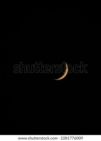 Crescent yellow moon picture with black background