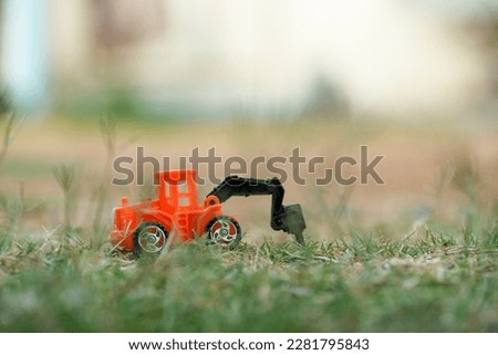 toy car excavator in the lawn