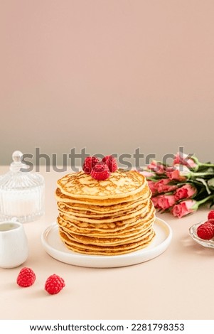 Stack of Pancakes with  raspberries 