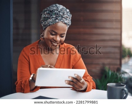 No simpler way to work. an attractive businesswoman working on her tablet in the office. Royalty-Free Stock Photo #2281799881
