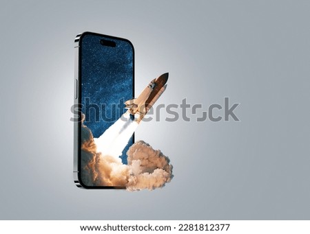 Space rocket takes off from mobile device with smoke, creative idea. Application and optimization, concept. Acceleration and successful startup Royalty-Free Stock Photo #2281812377