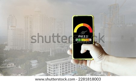 Using a mobile phone to scan for PM 2.5 in the city Royalty-Free Stock Photo #2281818003