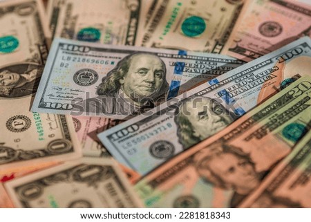 Scattered dollars obverse in view. The concept of inflation and banking problems in America
