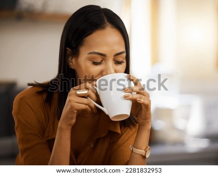 Happy, coffee and woman at home in a kitchen with a hot drink feeling relax and calm in the morning. Happiness, zen and young female drinking in a house holding a mug in a household with mockup Royalty-Free Stock Photo #2281832953