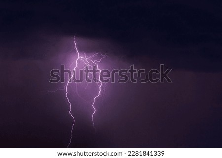 view on lightning in dark purple cloudy sky