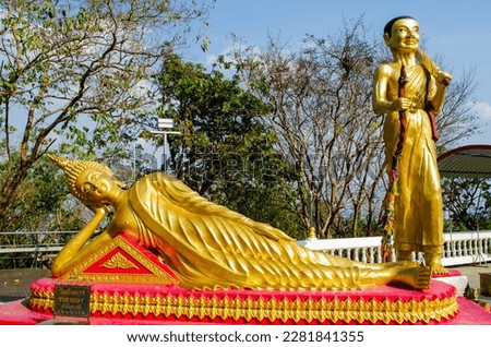 A golden statue of a reclining Buddha in the Temple of the Big Buddha in Pattaya. Buddha Purnima - Buddhas birthday