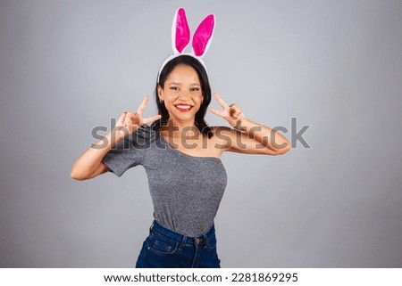 Brazilian woman, northeastern, wearing bunny ears, photo for Easter. peace and love.