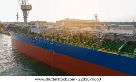 cargo container ship under maintenance crane at dry dock concept maintenance service working in the sea. Insurance and Maintenance Cargo Ship concept. Service maintenance Insurance