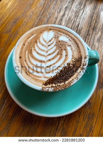 Coffee latte on glass at table