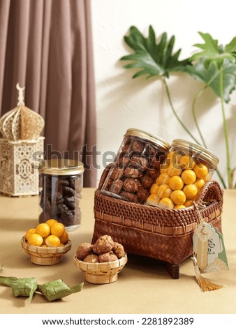 Selective focus of Hampers gift on Assorted Indonesian Cookies for Eid al Fitr and other special moment. such as Nastar,black caramel cookies, oat crunch cookies. Royalty-Free Stock Photo #2281892389