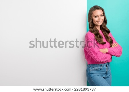 Photo of confident pretty girl wear pink sweater arms crossed poster empty space isolated turquoise color background