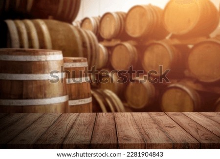 oak wood table on oak barrel background