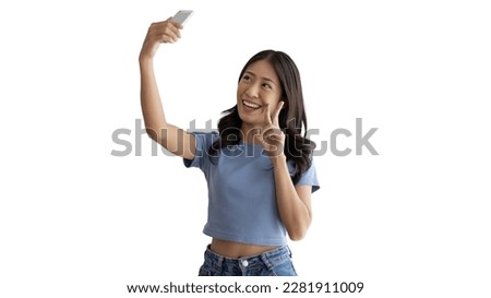 Cheerful young woman taking a selfie with a mobile phone and raising two fingers, Portrait of happy girl with bright face isolated on white background, Take a photo.