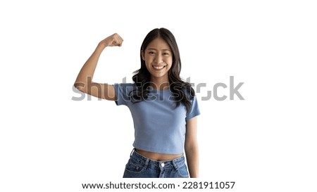 Woman flexing her muscles, Young Asian woman shows off her strength by flexing her jaw and showing off her power, Healthy, Happiness of your choice, White background. Royalty-Free Stock Photo #2281911057