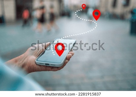 Tourist using navigation app on the mobile phone. High quality photo
