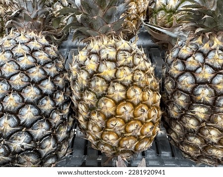 Fruit stand with delicious pineapple arrangement