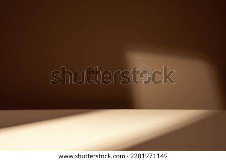 Table  for product display with brown background, shadows and natural sun light. Royalty-Free Stock Photo #2281971149