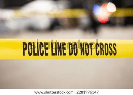 Cordon tape seals off a crime scene and establishes a police line for further investigations in Los Angeles, California, USA. Royalty-Free Stock Photo #2281976347