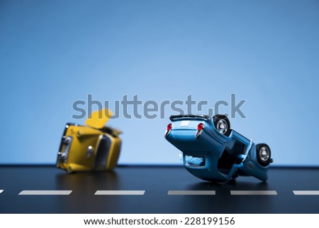 Classic fifties scale model toy cars accident on the road.